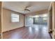 Cozy living space featuring laminate flooring, large windows, and seamless flow into other areas at 2203 18Th Street E Ct, Bradenton, FL 34208