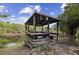 Picturesque gazebo overlooking tranquil waters, offering a serene and relaxing outdoor space at 230 Salisbury St, Port Charlotte, FL 33954