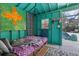 Whimsical pool house bedroom with vibrant decor, colorful artwork, and convenient access to the pool at 230 Salisbury St, Port Charlotte, FL 33954
