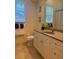 Bathroom with a large vanity, toilet, and window at 3716 Eagle Hammock Dr, Sarasota, FL 34240