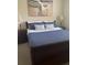 Comfortable bedroom features a queen-sized bed, side tables, and two lamps at 3716 Eagle Hammock Dr, Sarasota, FL 34240