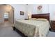 Comfortable bedroom features a queen-sized bed, soft carpet and ample natural light at 3716 Eagle Hammock Dr, Sarasota, FL 34240