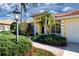 Charming home with a red tile roof, lush landscaping, and a welcoming walkway at 3716 Eagle Hammock Dr, Sarasota, FL 34240