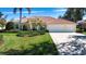 Beautiful home with a well-manicured lawn and a spacious three-car garage at 3716 Eagle Hammock Dr, Sarasota, FL 34240