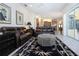 Inviting living room features leather sofas, and a stylish rug, perfect for relaxing or entertaining at 3716 Eagle Hammock Dr, Sarasota, FL 34240