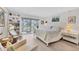 Serene bedroom boasts a sliding glass door to the balcony, providing ample natural light and beautiful views at 4350 Chatham Dr # 208, Longboat Key, FL 34228