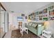 Cozy living room area with neutral walls, an elegant green sofa, and artwork creating a relaxing atmosphere at 4350 Chatham Dr # 208, Longboat Key, FL 34228