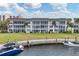 Beautiful waterfront condo with private dock and boat access, surrounded by lush landscaping at 4350 Chatham Dr # 208, Longboat Key, FL 34228