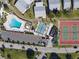Aerial view of the community featuring the pool, shuffleboard, and tennis courts at 4714 Potomac Cir, Bradenton, FL 34210
