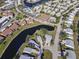 Aerial view of the community and its winding canals with nearby golf courses and community features at 4714 Potomac Cir, Bradenton, FL 34210