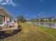 Waterfront backyard with a patio, perfect for enjoying scenic views and outdoor dining at 4714 Potomac Cir, Bradenton, FL 34210