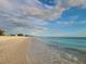 Scenic beach shot showcasing white sands, blue water, and clear skies at 4714 Potomac Cir, Bradenton, FL 34210