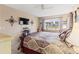 Comfortable bedroom with a view, featuring soft lighting and a relaxing atmosphere at 4714 Potomac Cir, Bradenton, FL 34210
