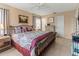 Cozy bedroom featuring a comfortable bed with decorative pillows and warm, inviting decor at 4714 Potomac Cir, Bradenton, FL 34210