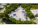 Aerial view of a community boat storage area surrounded by lush landscaping and trees at 4714 Potomac Cir, Bradenton, FL 34210