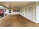 Spacious covered carport with ample storage cabinets, offering convenient sheltered parking and entry at 4714 Potomac Cir, Bradenton, FL 34210