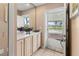 Welcoming entryway with storage cabinets and a view of the front yard through the glass door at 4714 Potomac Cir, Bradenton, FL 34210