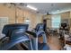 Well-equipped fitness center with treadmills, weight machines, and ample workout space at 4714 Potomac Cir, Bradenton, FL 34210