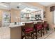 Eat-in kitchen with bar seating and views to outside at 4714 Potomac Cir, Bradenton, FL 34210