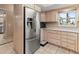 Kitchen featuring stainless steel refrigerator, ample counter space, and tile backsplash at 4714 Potomac Cir, Bradenton, FL 34210