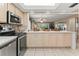 Bright kitchen with stainless steel appliances and ample counter space at 4714 Potomac Cir, Bradenton, FL 34210