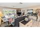 Spacious living room leads to an outdoor seating area, offering seamless indoor/outdoor living at 4714 Potomac Cir, Bradenton, FL 34210