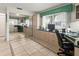 Bright office space with built-in desks, ample storage, and a large mirror reflecting the room at 4714 Potomac Cir, Bradenton, FL 34210