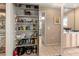 Well-stocked pantry with sliding door providing ample storage in a home at 4714 Potomac Cir, Bradenton, FL 34210