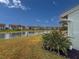 Scenic water view from the backyard with lush landscaping and a glimpse of the home's exterior at 4714 Potomac Cir, Bradenton, FL 34210
