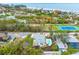 Aerial view of home, pool, and neighborhood near the beach at 541 Edlee Ln, Longboat Key, FL 34228