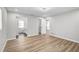 Spacious bedroom featuring wood-look floors, neutral walls, and a walk-in closet and en-suite bathroom at 5445 Bahia Vista St, Sarasota, FL 34232