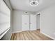 Bright bedroom features a ceiling fan, wood-look flooring, and double-door closet for ample storage at 5445 Bahia Vista St, Sarasota, FL 34232
