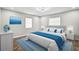 Stylishly furnished bedroom with a plush rug, comfortable bed, and ample natural light from the windows at 5445 Bahia Vista St, Sarasota, FL 34232