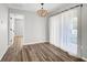 Dining area featuring modern lighting, neutral paint, and a view into the hall at 5445 Bahia Vista St, Sarasota, FL 34232