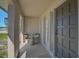 Cozy front porch featuring seating, decorative columns, and a charming porch sign at 5445 Bahia Vista St, Sarasota, FL 34232