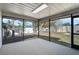 Inviting screened porch provides a serene transition to the backyard, perfect for outdoor relaxation at 5445 Bahia Vista St, Sarasota, FL 34232