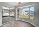 Bright sunroom with large windows overlooking the backyard and a sliding glass door at 5445 Bahia Vista St, Sarasota, FL 34232
