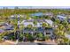 Beautiful waterfront property featuring lush landscaping and serene water views at 6750 Gulf Of Mexico Dr # 153, Longboat Key, FL 34228