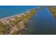 Aerial view of waterfront homes with private docks on Lemon Bay and Gulf access at 777 N Manasota Key Rd, Englewood, FL 34223