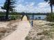 Brick walkway to private dock overlooking the water at 777 N Manasota Key Rd, Englewood, FL 34223