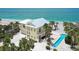 Stunning beach house with a metal roof, a pool, and beautiful beach access at 777 N Manasota Key Rd, Englewood, FL 34223