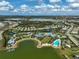 Community aerial view showcasing the lake, clubhouse, pool, and surrounding homes at 8261 Grande Shores Dr, Sarasota, FL 34240