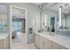 Serene bathroom featuring double sinks, a luxurious vanity, and modern fixtures at 8261 Grande Shores Dr, Sarasota, FL 34240