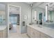 The spacious bathroom with double vanity and a large mirror, providing a luxurious and functional space at 8261 Grande Shores Dr, Sarasota, FL 34240