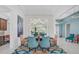 Stylish dining room with a large mirror, modern lighting, and colorful accents that create an elegant atmosphere at 8261 Grande Shores Dr, Sarasota, FL 34240