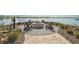 Inviting lakeside fire pit area with comfortable seating, perfect for relaxing evenings at Lakehouse Cove at 8261 Grande Shores Dr, Sarasota, FL 34240