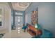 Bright foyer with high ceilings, modern lighting, and stylish decor creating an inviting entrance at 8261 Grande Shores Dr, Sarasota, FL 34240