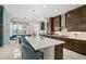 The gourmet kitchen features a large island, stainless steel appliances, and sleek cabinetry at 8261 Grande Shores Dr, Sarasota, FL 34240