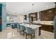 Well-equipped kitchen with granite countertops, stainless steel appliances, and a breakfast nook at 8261 Grande Shores Dr, Sarasota, FL 34240