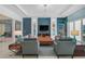 Stylish living room featuring sophisticated furnishings, custom shelving, and a serene ambiance at 8261 Grande Shores Dr, Sarasota, FL 34240